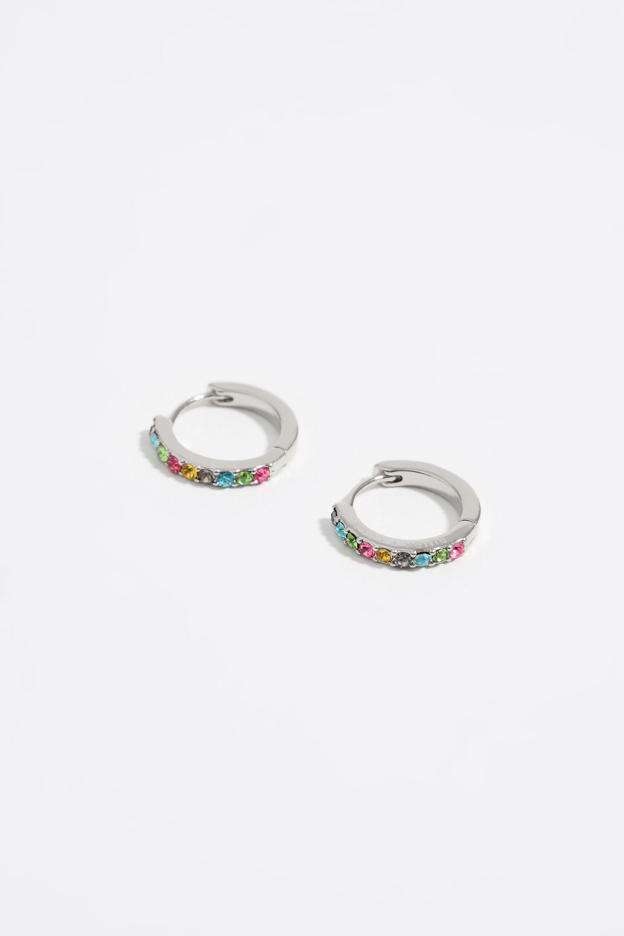 Silver metal hoop earrings with crystals