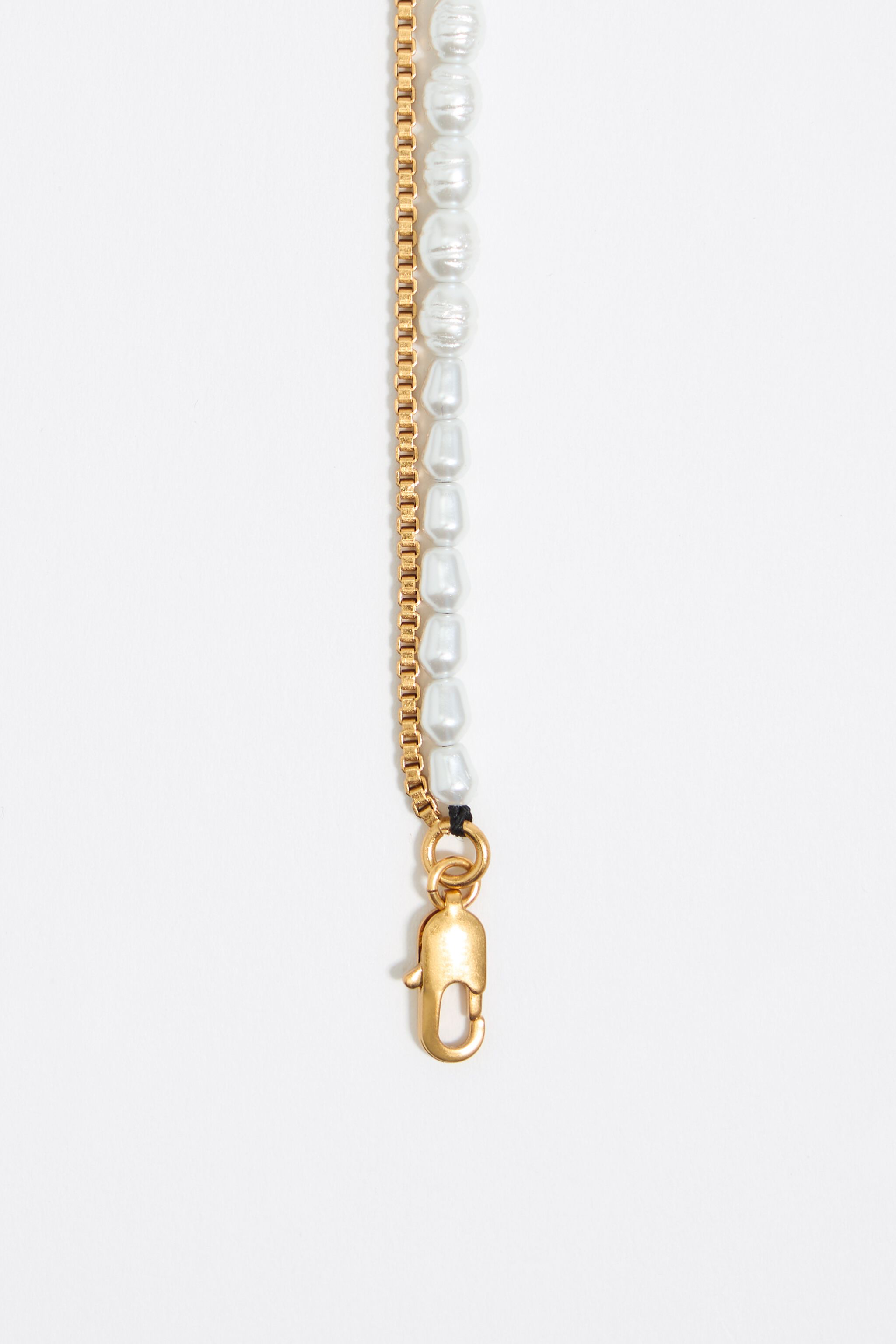 Gold coin logo and pearl necklace