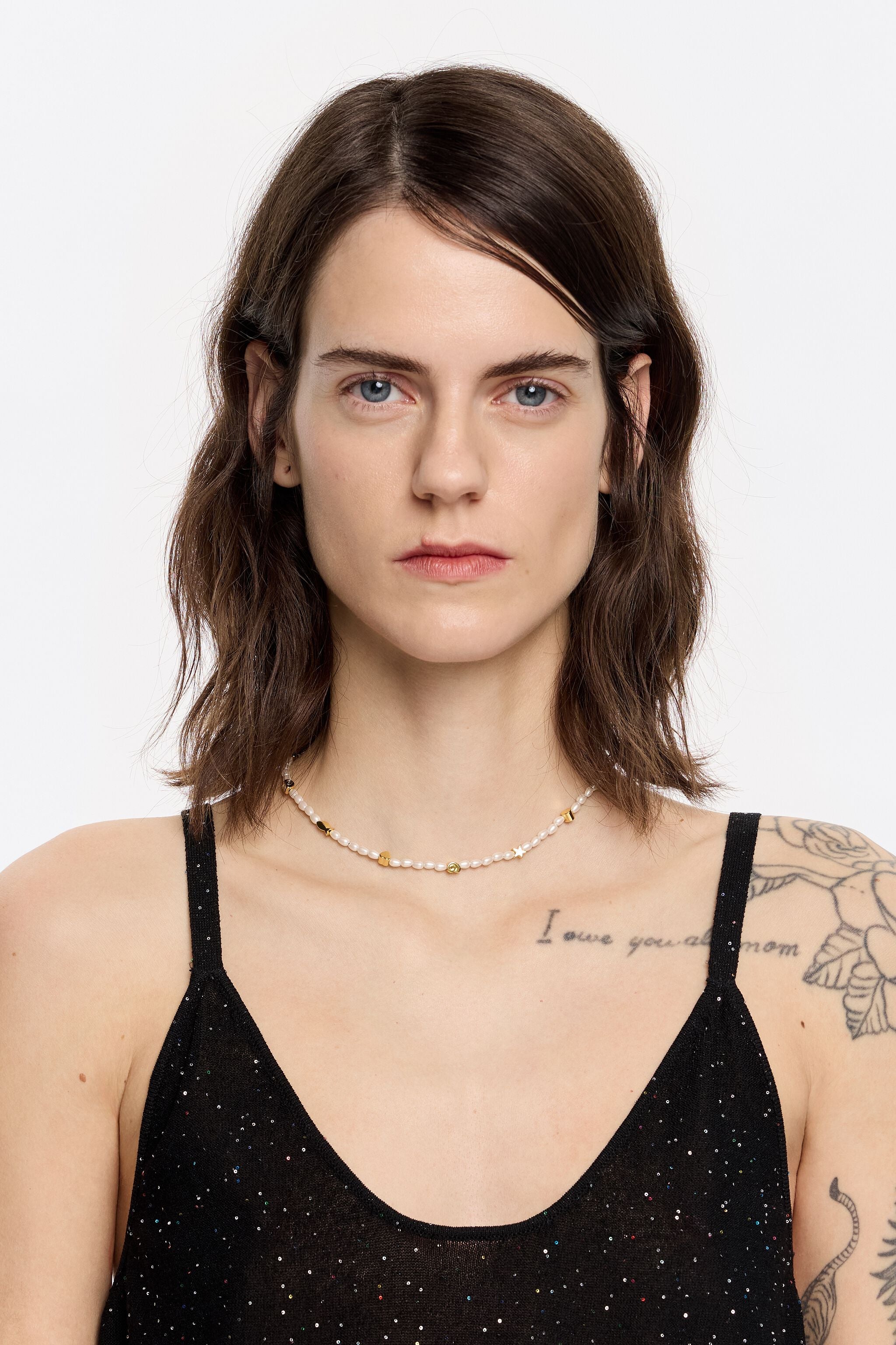 Gold marine motifs and pearl necklace
