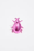 Pink beetle charm