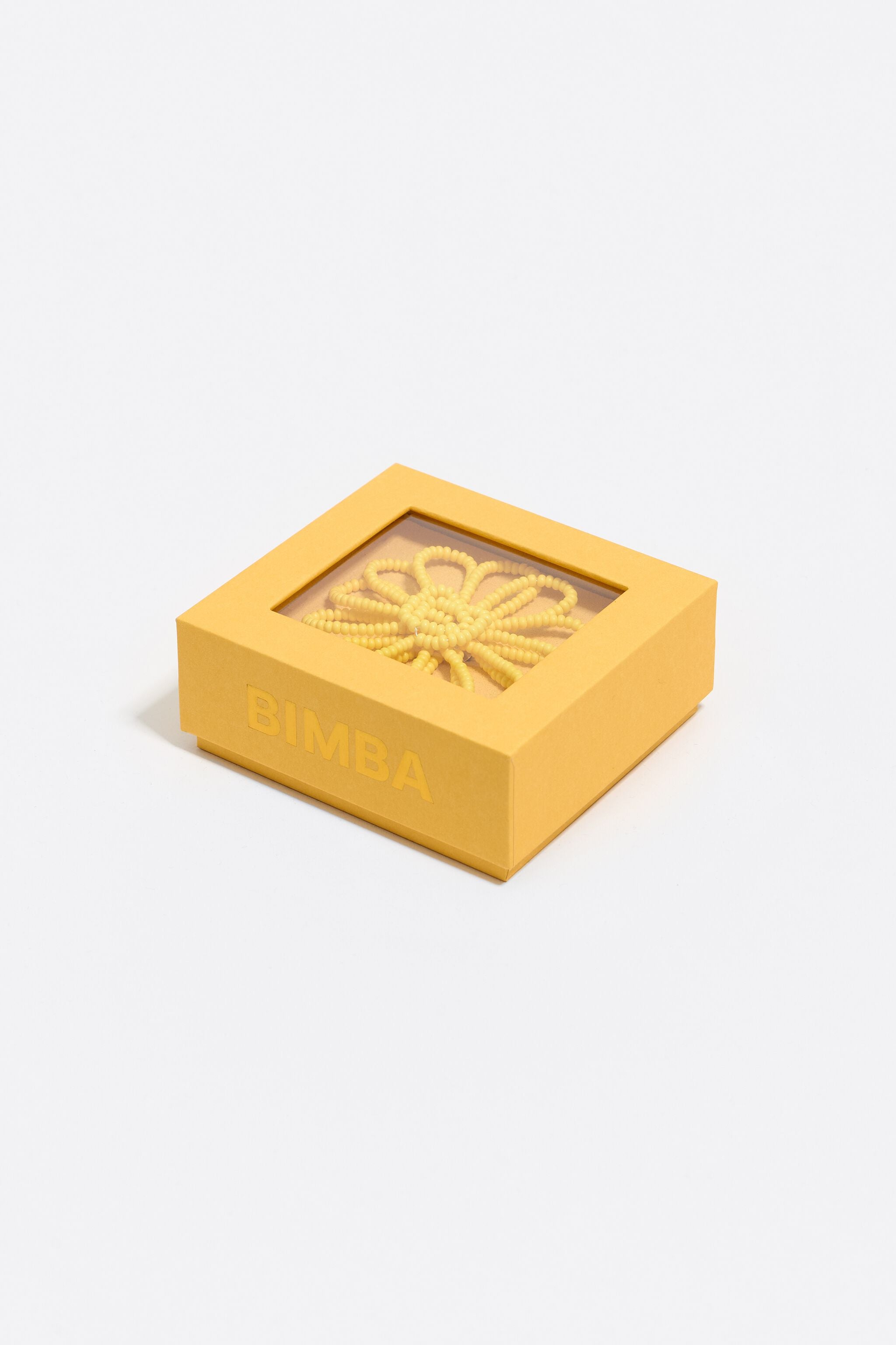Yellow beaded flower charm