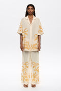 Straight vanilla trousers with embroidery and frayed details