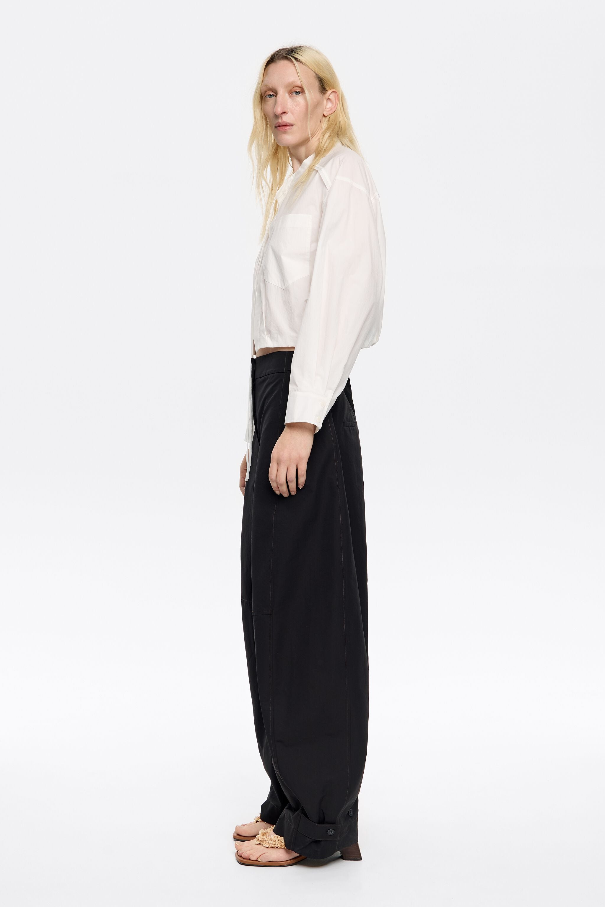 Black technical fabric barrel leg trousers