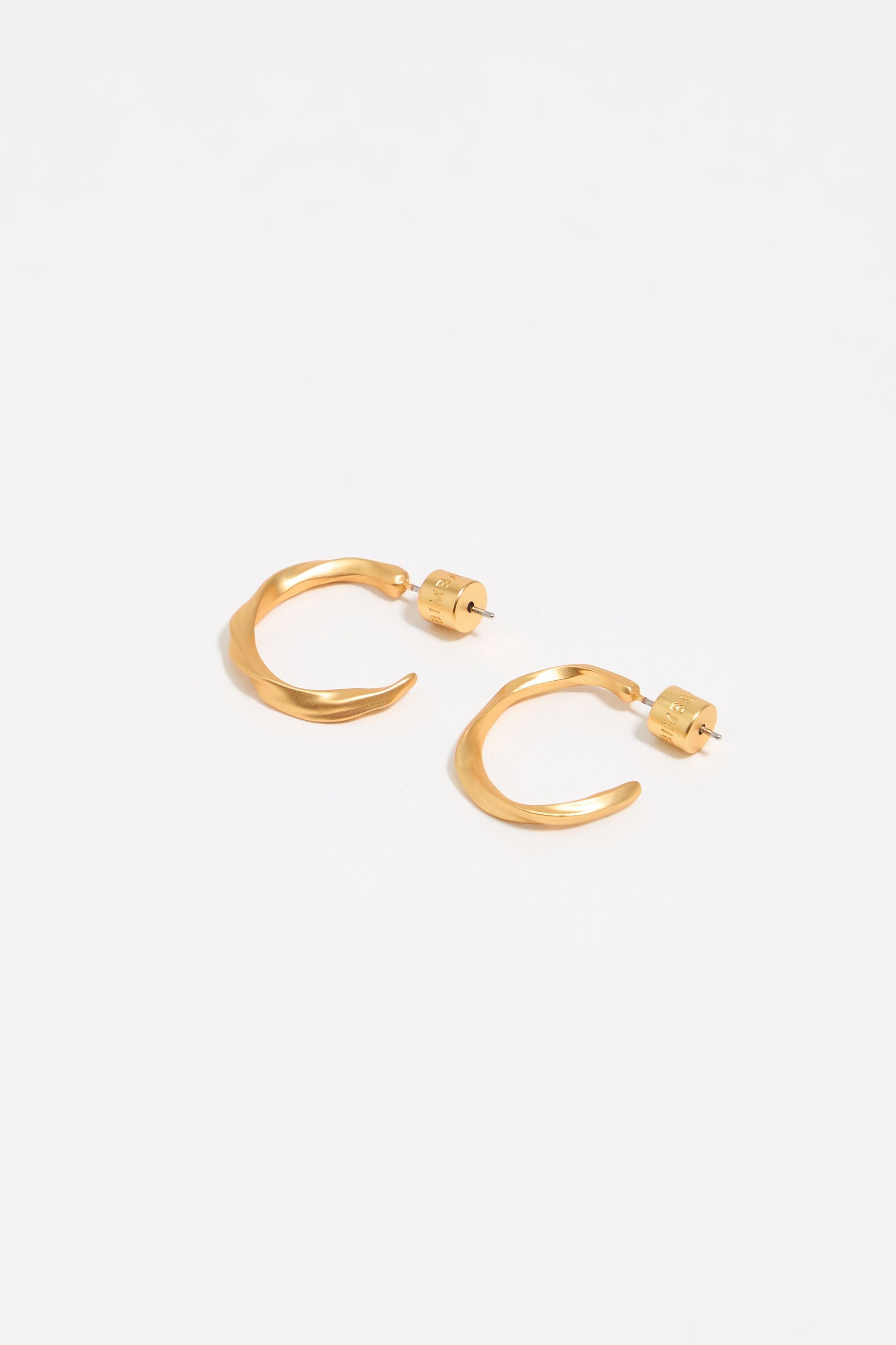 Matte gold uneven hoop earrings