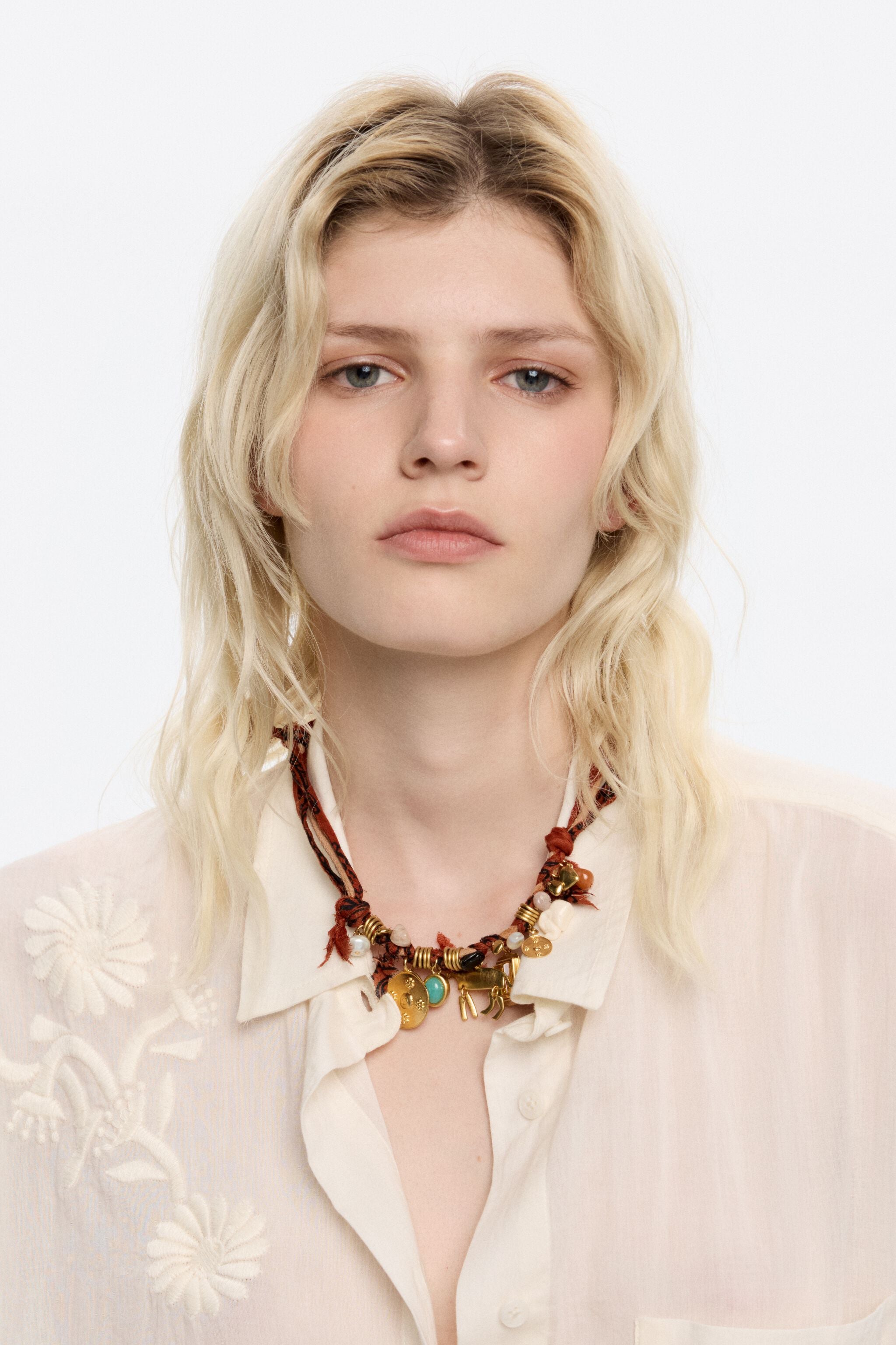 Plaited fabric necklace with gold-tone metal motifs