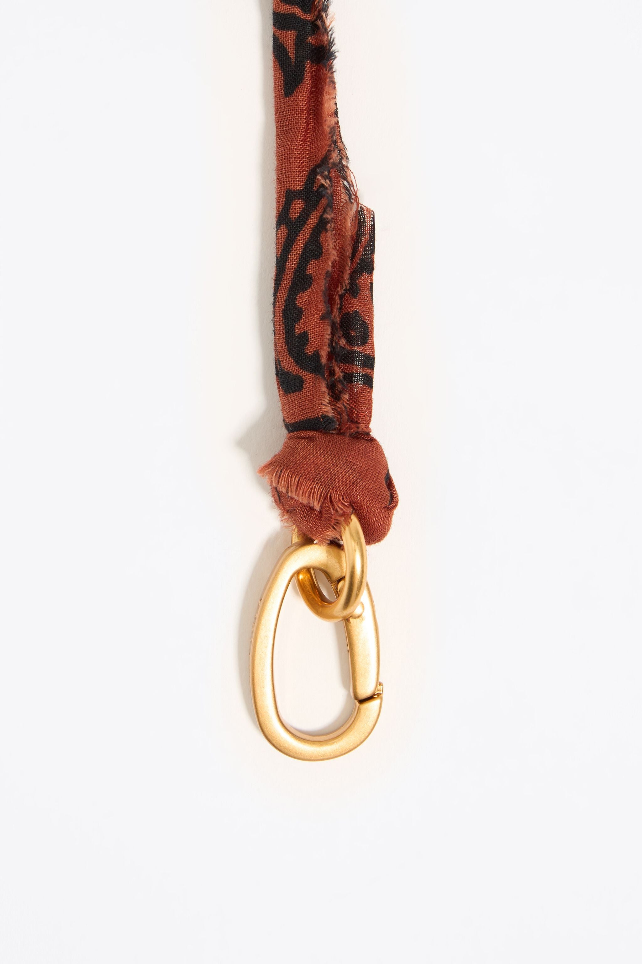 Plaited fabric necklace with gold-tone metal motifs