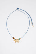 Long plaited cord necklace with gold-tone metal motifs